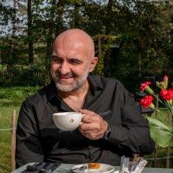 Relationship coach Dimitar Shivachev with cup of coffee in his hand