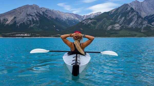 woman in kayak - stress-free holidays
